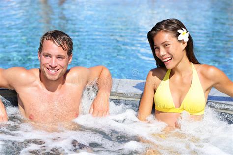 Wellness Spa Couple Relaxing In Hot Tub Whirlpool Stock
