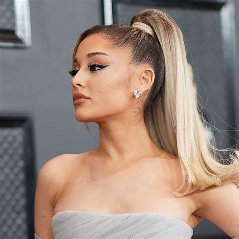 Ariana Grande Poses In A Plaid Corset Top And Black Mini Skirt On