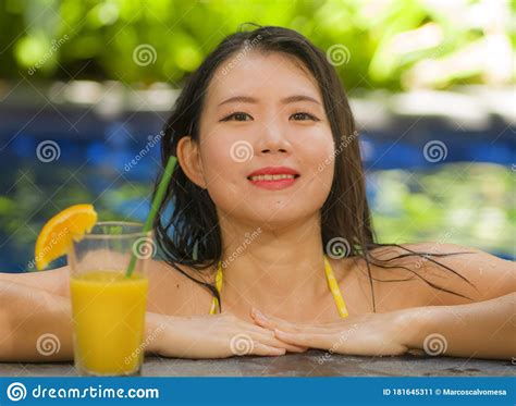 Young Beautiful And Happy Asian Chinese Woman In Bikini Enjoying
