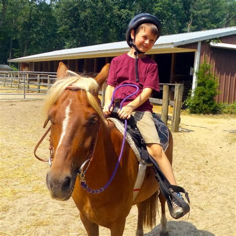 boy riding horse ymca   pines