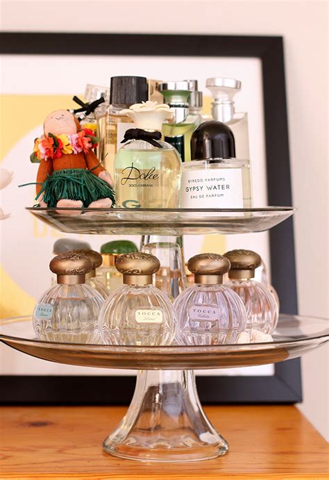 a sweet way to display your perfumes use a cake stand