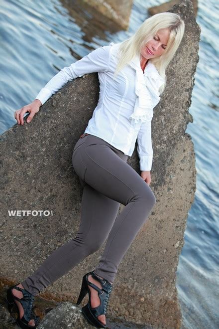 wetlook by beautiful woman in white blouse brown leggings and shoes ate sea wetlook one