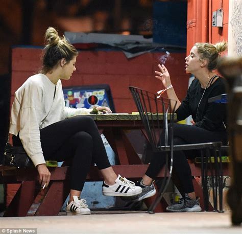 Ashley Benson Puffs On A Cigarette As She Chats With A Pal In Hollywood