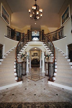 toll brothers  story foyer  curved staircases double staircase home staircase design