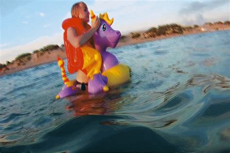 Alla Is Riding An Inflatable Magic Dragon On The Sea