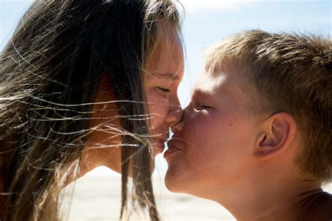 brother kisses his sisterbrother and sister kiss each otherthe concept