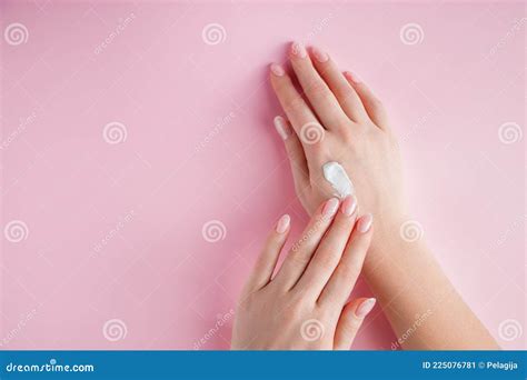 young woman  applying cream   hands spa  body care concept