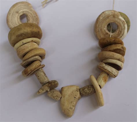 upper paleolithic circa  bc necklace composed  carved shells  animal bones