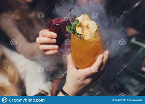 Woman`s Hand Holding Old Fashioned Glass With Cold