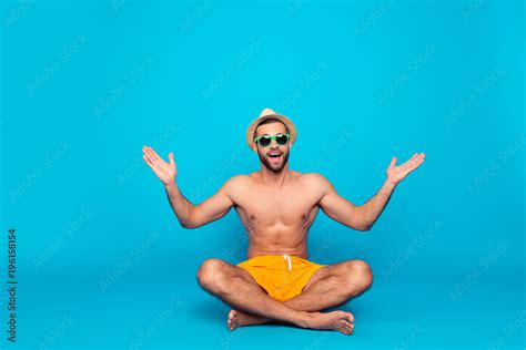 cheerful funny attractive ladies man with naked torso in yellow