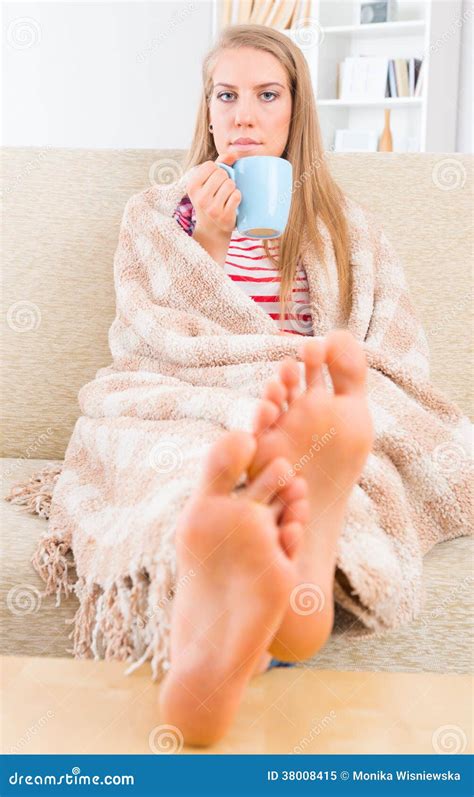 young woman covered  blanket stock image image  feet lifestyle