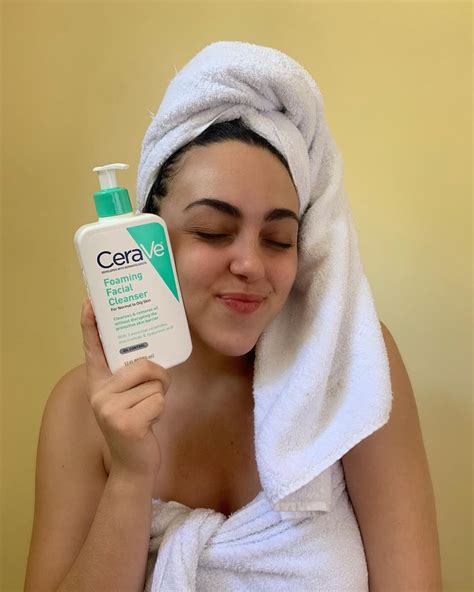 A Girl Holding A Cerave Facial Cleanser And Posing With It Photography
