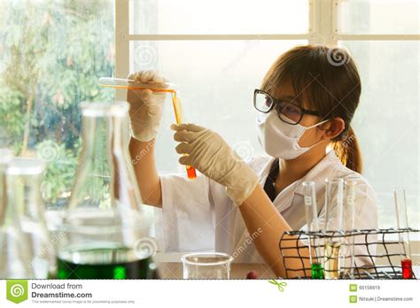 young female scientist mixing chemical stock image image  laboratory computer