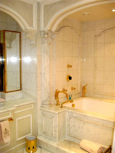 bathroom   hotel le ritz  paris note  gold swan shaped faucets trendy bathroom
