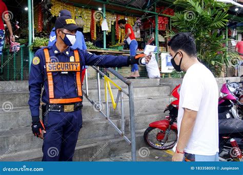 security guard check temperature  customers   public market   covid  virus