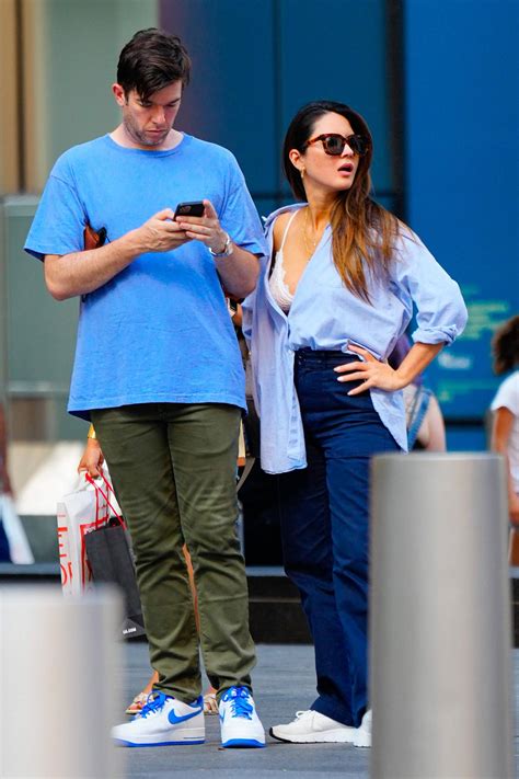 olivia munn and john mulaney hold hands as they go shopping at