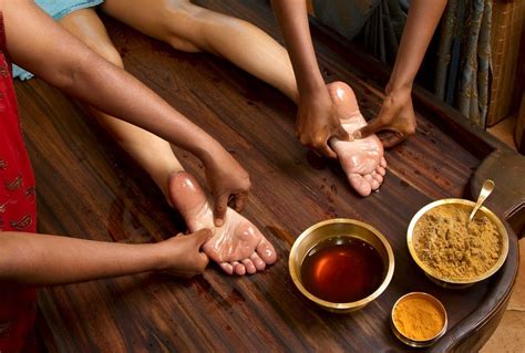 Indian Practitioners Give A Traditional Ayurvedic Oil Foot Massage
