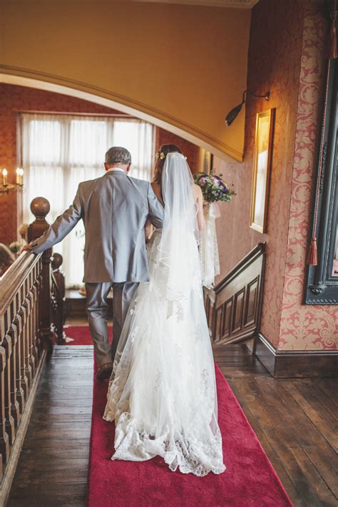 classic wedding at ellingham hall in northumberland with bride in madeline gardner dress and