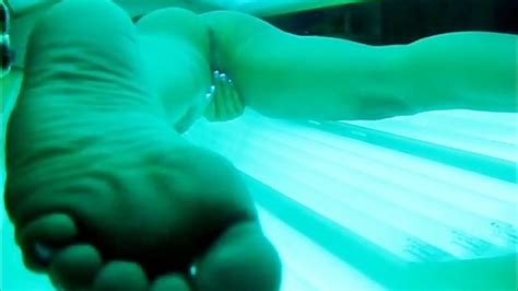 hot milf secretly filmed masturbating in tanning bed