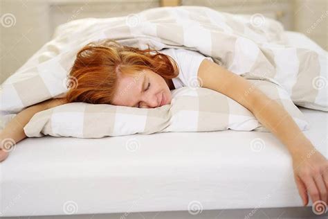 exhausted woman sleeping spread out on the bed stock image image of