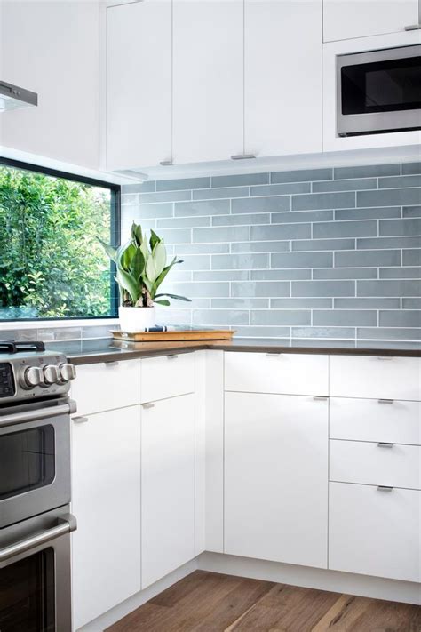 blue gray glass tile backsplash adds color  sleek modern kitchen modern kitchen kitchen