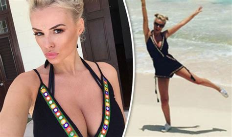 Rhian Sugden Struggles To Contain Her Assets In Very Plunging Playsuit