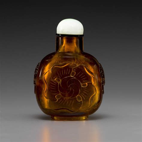 An Amber Colored Glass Mallow Flower Bottle Flower Bottle Colored