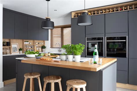 stunning modern handleless kitchen mixing dark grey  wood effect cabinets pictured