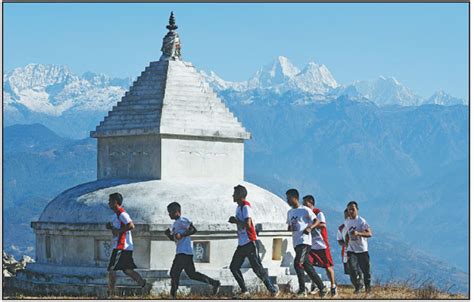 nepali buddhist monks run during a training session in