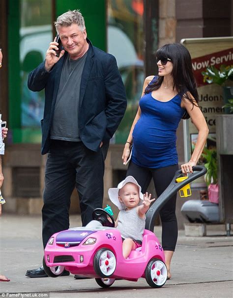 alec baldwin dotes on pregnant wife hilaria as she dresses her growing belly in a tight shirt