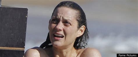marion cotillard topless swimming for rust and bone photo