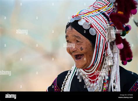 Smiling Woman With Headdress Of The Akha Hill Tribe Ethnic Minority