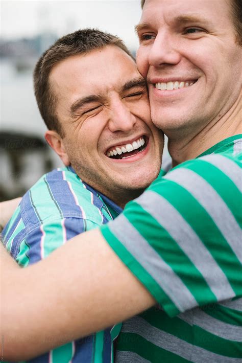 Happy Gay Couple Hugging Outdoors By Stocksy Contributor Simone Wave