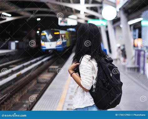 Woman Waiting Sky Train Arrival On Platform At Night Stock Image