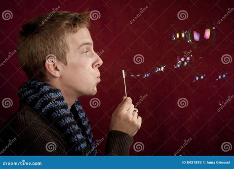 young man blowing  bubbles stock image image  male playful