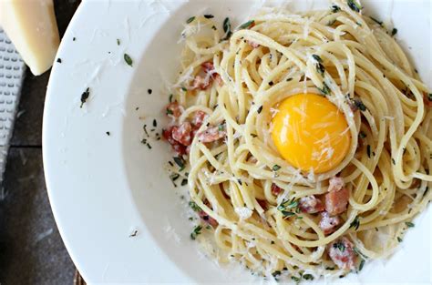 spaghetti carbonara with egg yolk on top buonissimo carbonara with