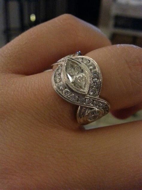 East-West Marquise cut bezel set with infinity twist