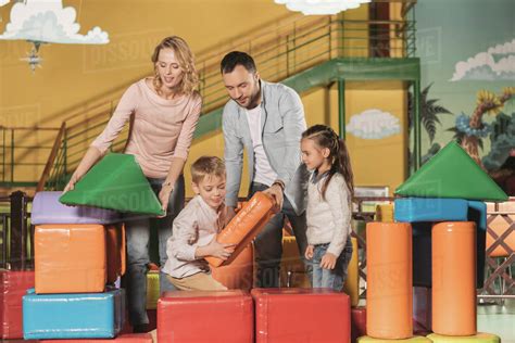 happy family playing   colorful blocks  indoor play