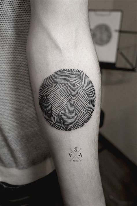 Simple Homemade Like Black Ink Circle Tattoo On Arm Tattooimages
