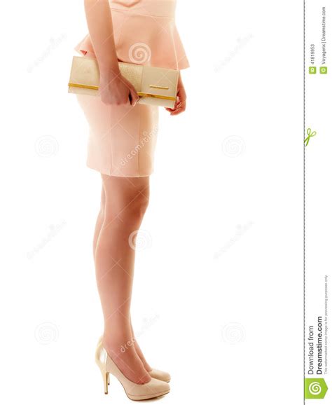Handbag And Legs Of Girl In Pink Dress And High Heels