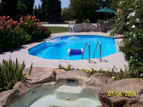 partly buried landscaping solutions pool patio backyard