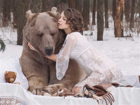 russian models pose with a bear business insider