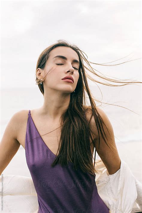Beautiful Sensual Caucasian Woman Posing With Closed Eyes On Windy