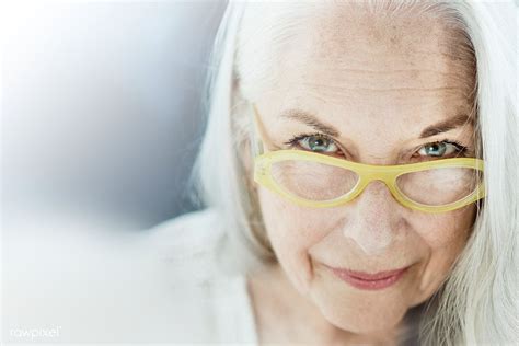 Download Premium Image Of Portrait Of An Elderly Woman With A Yellow