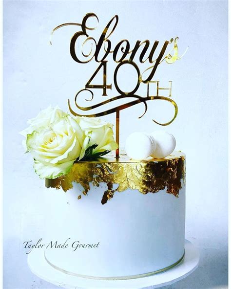 happy birthday ebony ebonys cake featured gold leaf  fresh blooms macarons