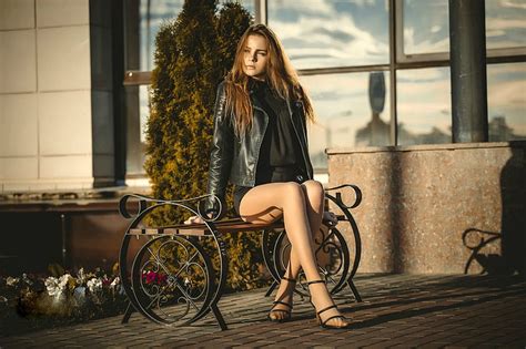 model posing on a bench brunette high heels legs model bench