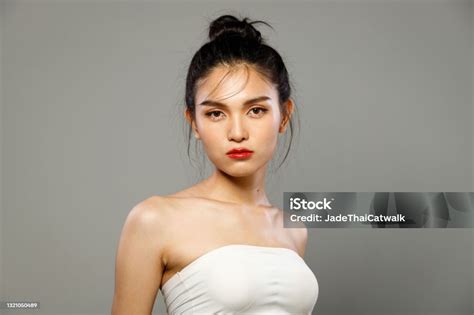 Portrait Of 20s Asian Lgbtqia Woman Black Hair White Vast Dress Stock