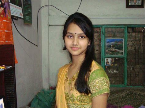 cute smile of a desi indian female at her house kuch