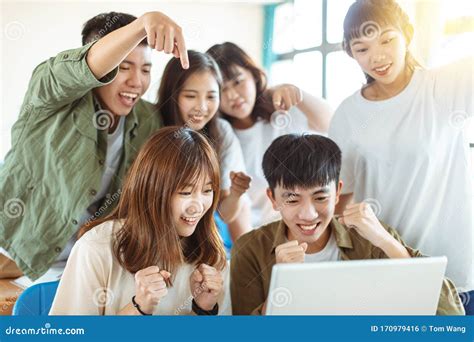 excited college students   laptop  classroom stock photo image  chatting laptop