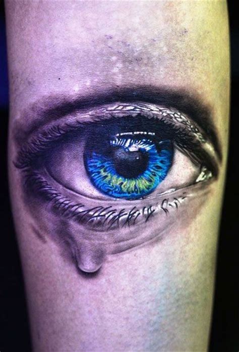 tearful blue eye tattoo on hand tattooimages